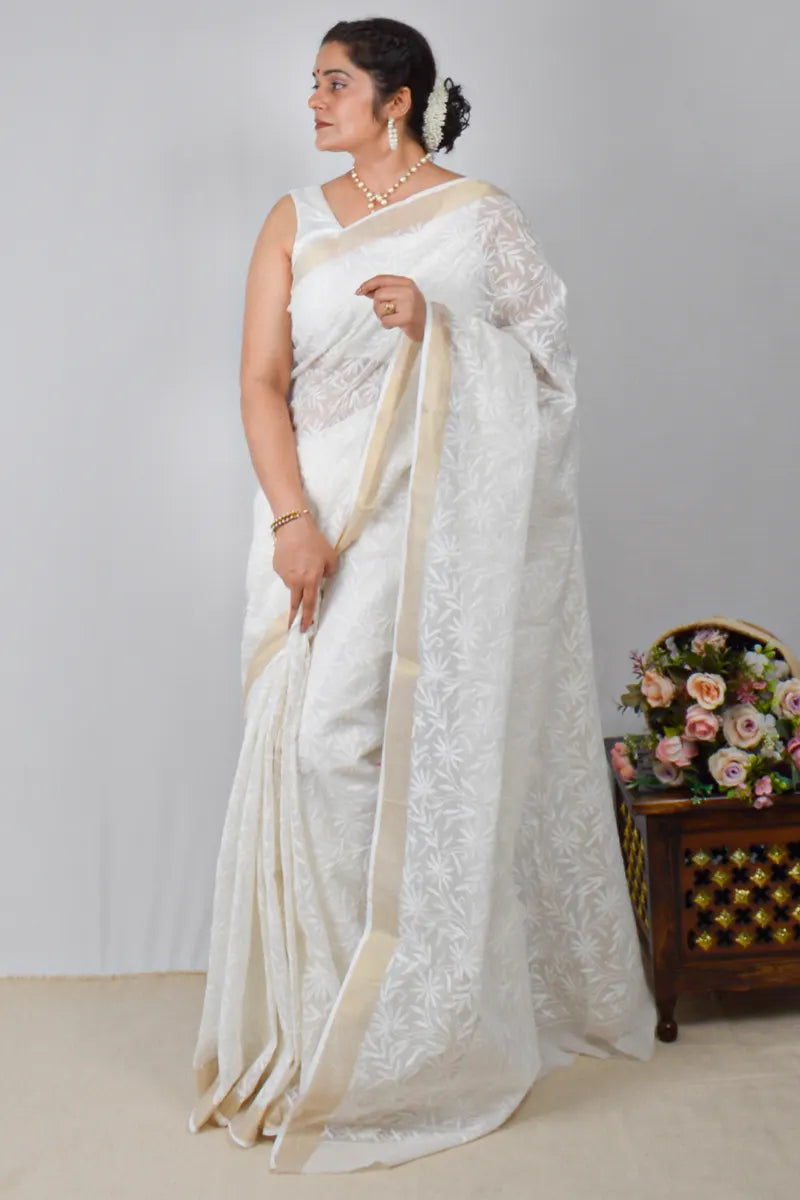 White Kota cotton saree with Lucknowi Chikankari and zari border, paired with matching blouse – handcrafted by MeMaana.