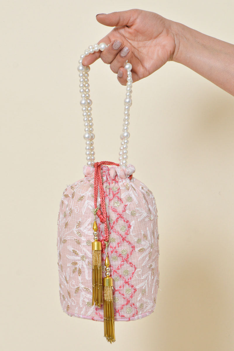 Fabnuma Handcrafted Pink Chikankari Potli Bag with intricate embroidery and pearl handle in Kota cotton fabric.