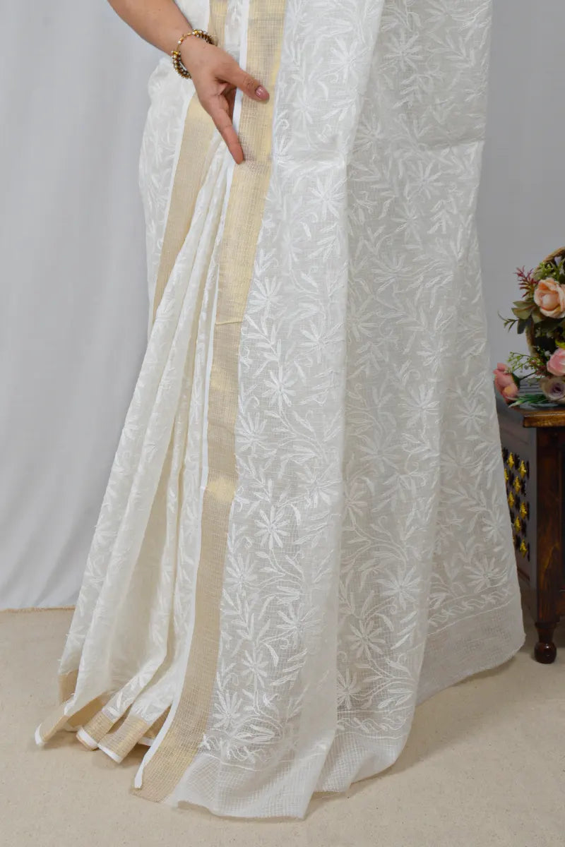 White Kota cotton saree with Lucknowi Chikankari and zari border, paired with matching blouse – handcrafted by MeMaana.