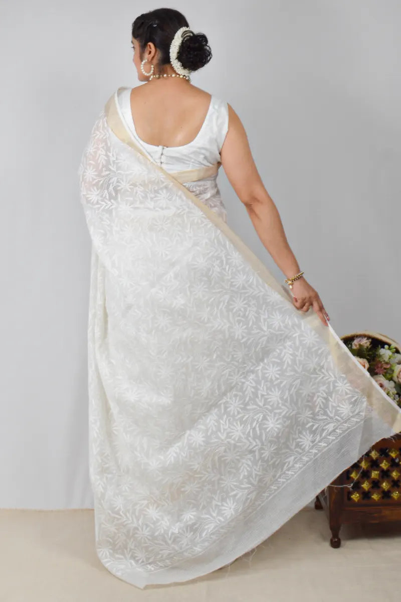 White Kota cotton saree with Lucknowi Chikankari and zari border, paired with matching blouse – handcrafted by MeMaana.