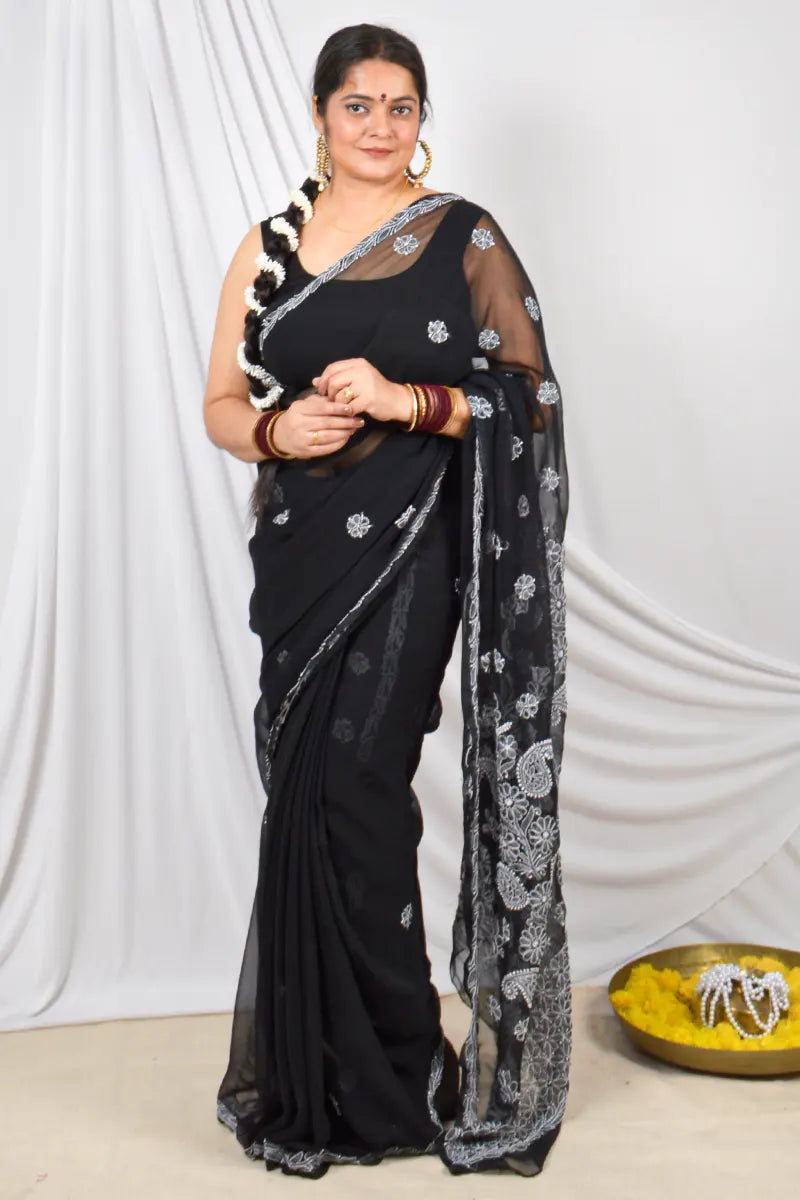 Handcrafted Black Georgette saree intricate Lucknowi Chikankari embroidery and a matching blouse, ideal for festive and wedding occasions.