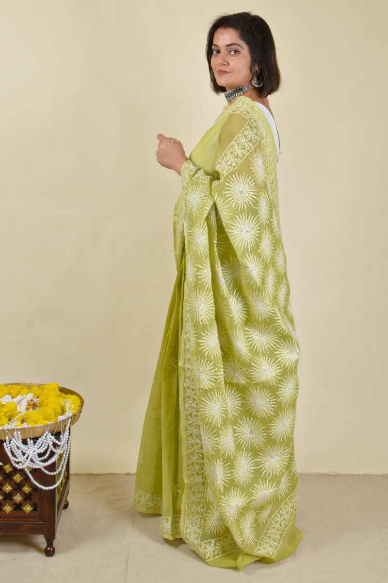 Handcrafted Green Kota Cotton Saree with intricate Lucknowi Chikankari embroidery and a matching blouse, ideal for festive and wedding occasions.