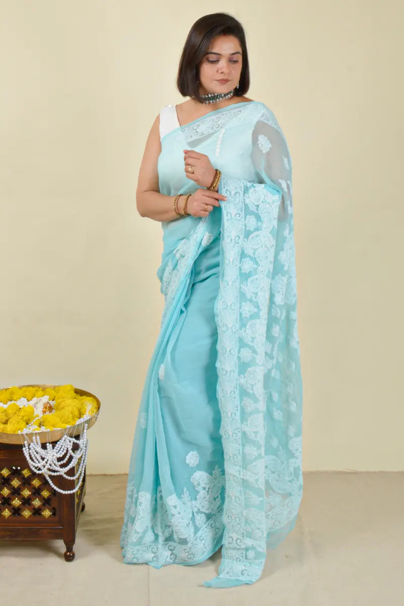 Handcrafted Georgette saree with intricate Lucknowi Chikankari Embroidery and a matching Blouse, ideal for festive and wedding occasions.