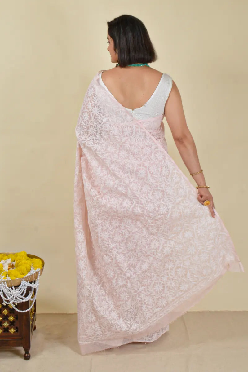 Handcrafted Baby Pink Kota Cotton saree with intricate Lucknowi Chikankari embroidery and a matching blouse, ideal for festive and wedding occasions.