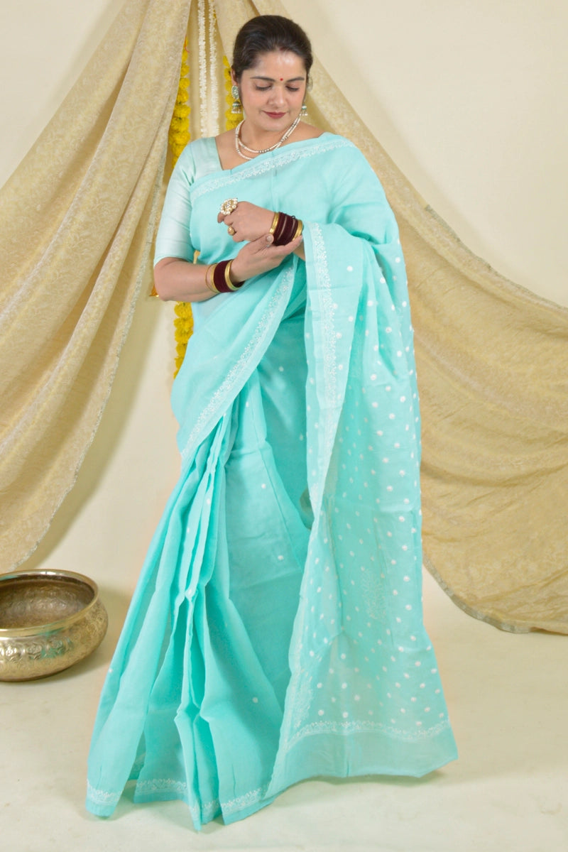 Handcrafted Sea Green Cotton Saree with intricate Lucknowi Chikankari embroidery and a matching blouse, ideal for festive and wedding occasions.
