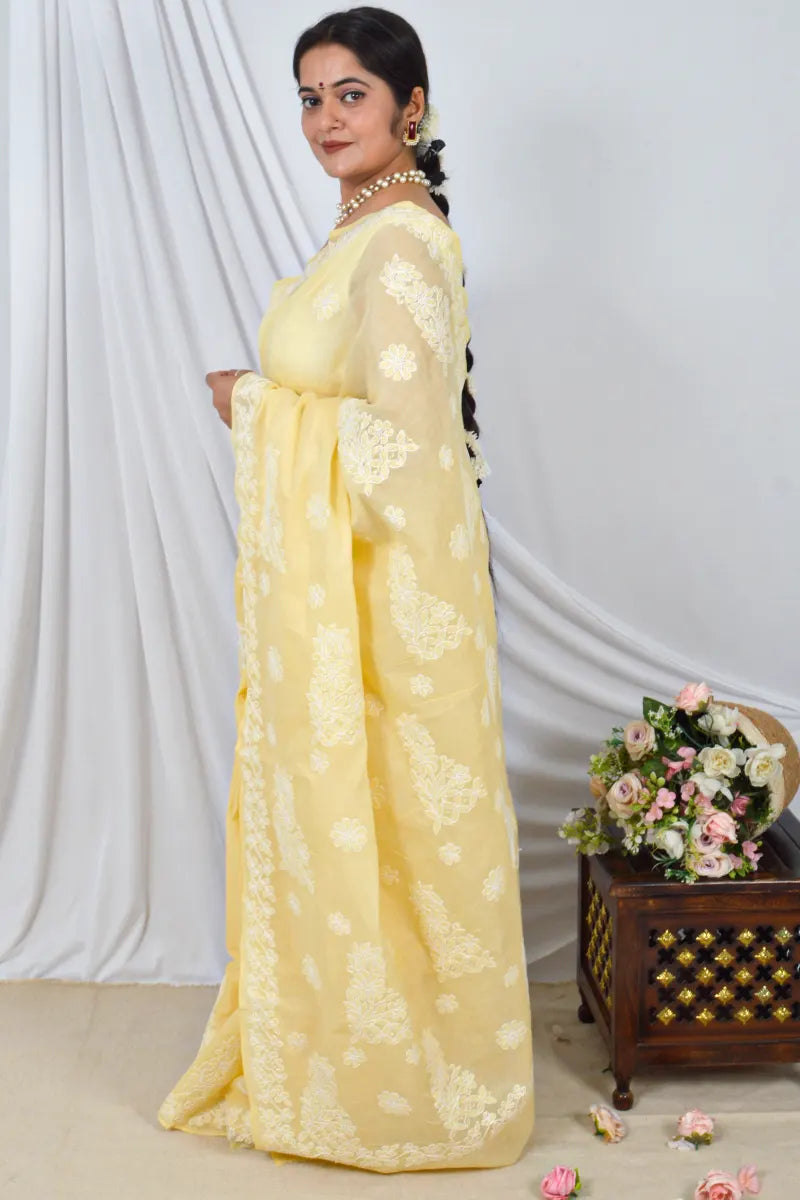 Handcrafted Yellow cotton Saree with intricate Lucknowi Chikankari embroidery and a matching Blouse, ideal for Festive and occasions.