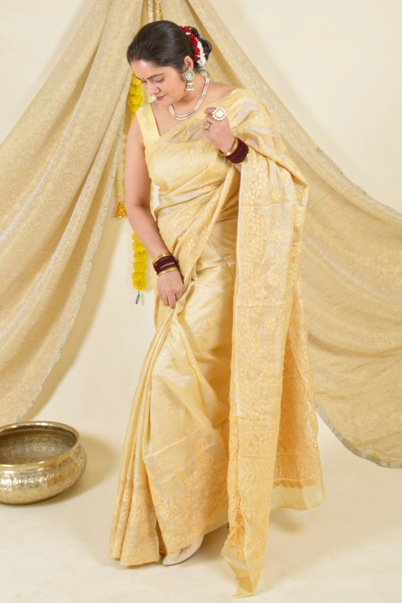 Handcrafted Brown Tussar Silk saree with intricate Lucknowi Chikankari embroidery and a matching blouse, ideal for festive and wedding occasions.