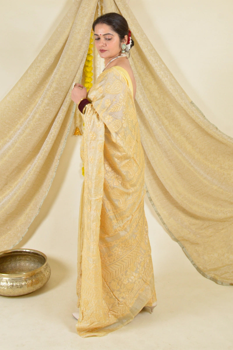 Handcrafted Brown Tussar Silk saree with intricate Lucknowi Chikankari embroidery and a matching blouse, ideal for festive and wedding occasions.