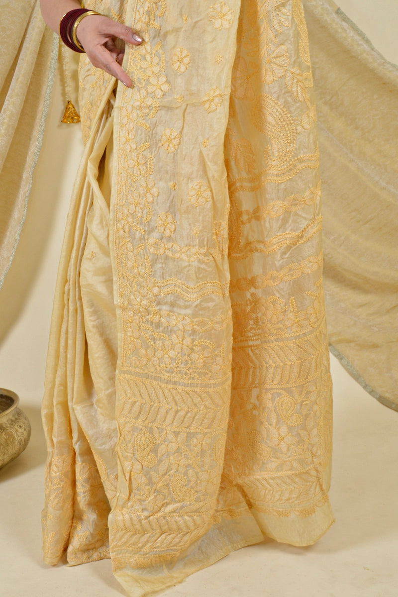 Handcrafted Brown Tussar Silk saree with intricate Lucknowi Chikankari embroidery and a matching blouse, ideal for festive and wedding occasions.