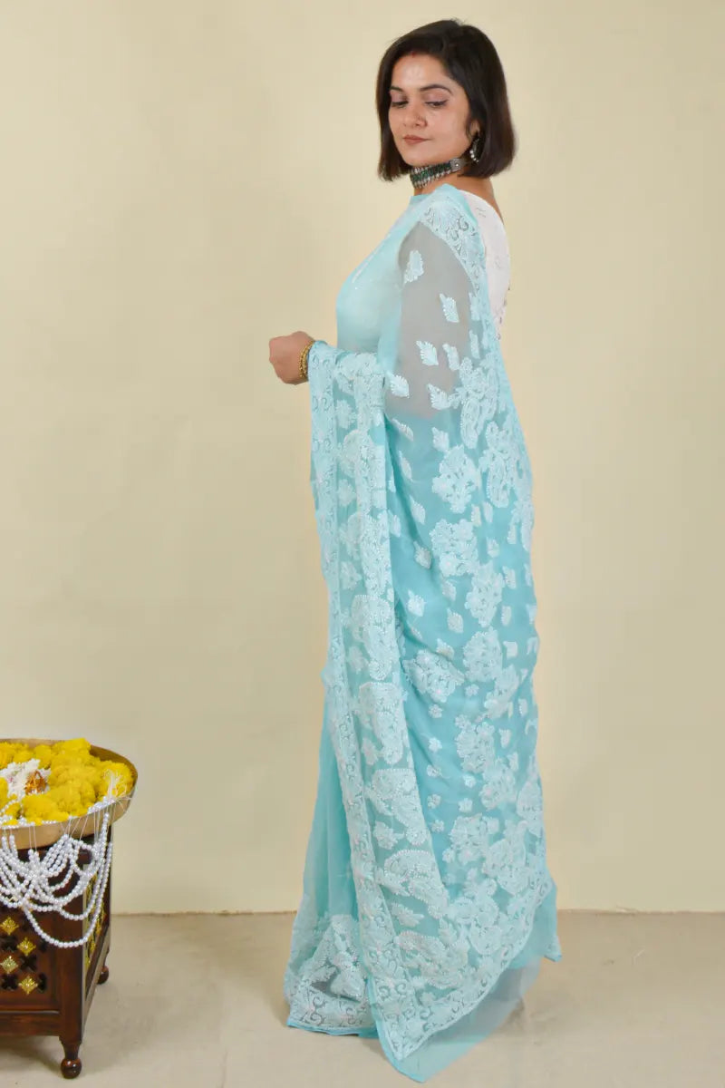 Handcrafted Georgette saree with intricate Lucknowi Chikankari Embroidery and a matching Blouse, ideal for festive and wedding occasions.