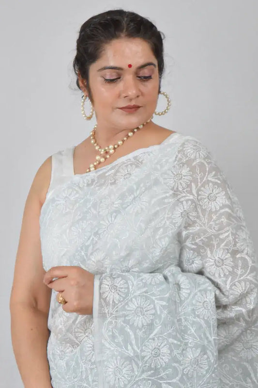 Light gray Kota cotton saree with hand-embroidered Lucknowi Chikankari and matching blouse – breathable and handcrafted ethnic saree by MeMaana.