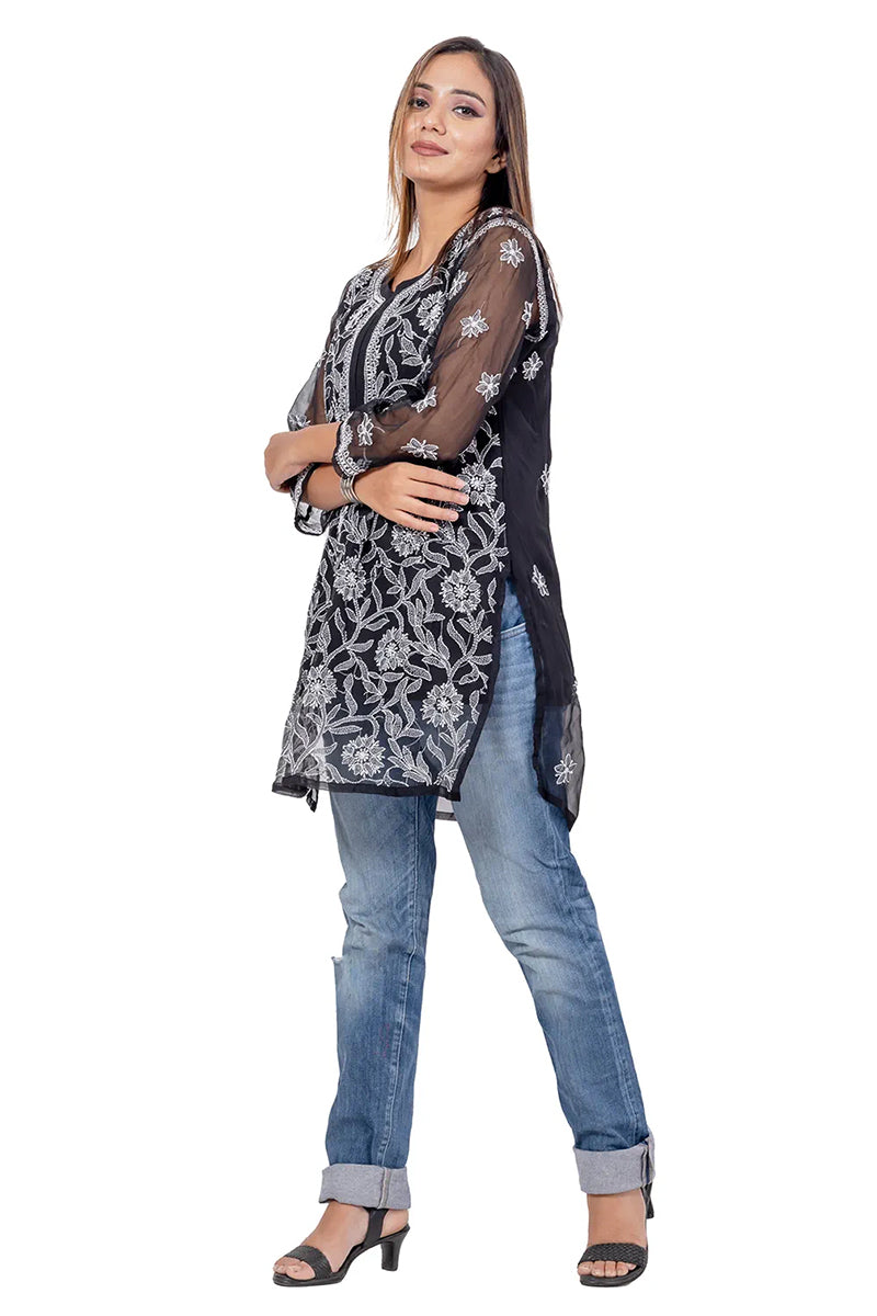 Fabnuma Handcrafted Chikankari Black Georgette Short Kurti Top worn by woman with intricate white embroidery.