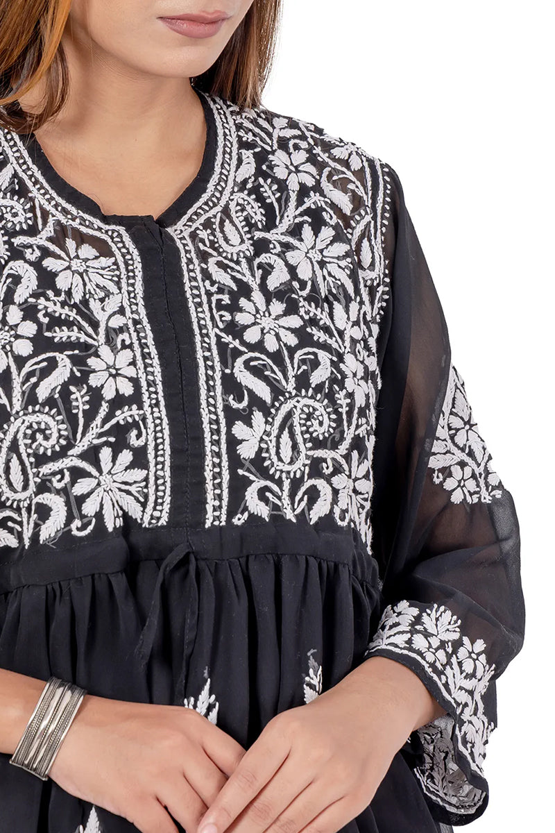 Fabnuma Handcrafted Chikankari Black Georgette Short Tops with intricate white floral embroidery and sheer sleeves.