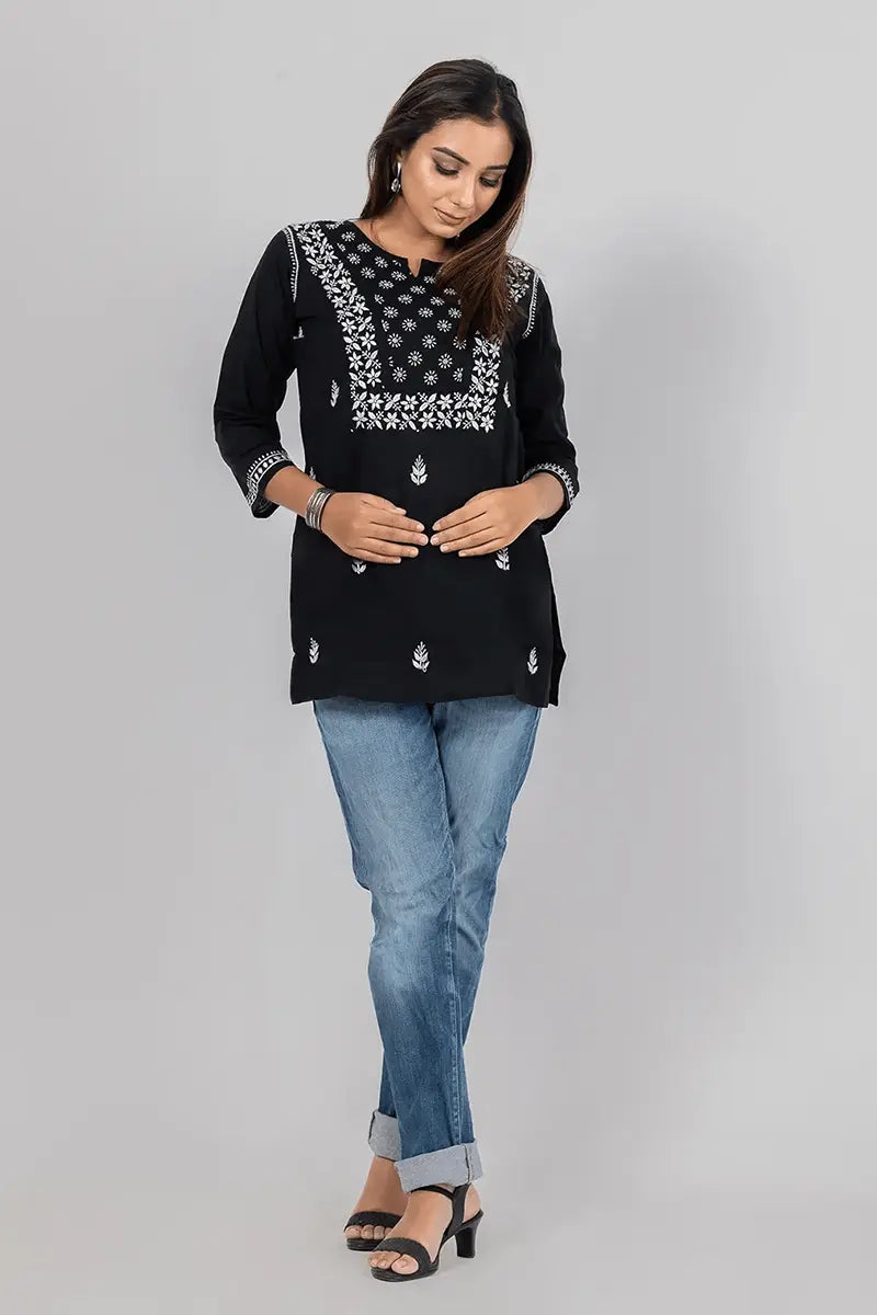 Fabnuma Handcrafted Chikankari Cotton Black Short Top with intricate white embroidered floral design on black cotton fabric.