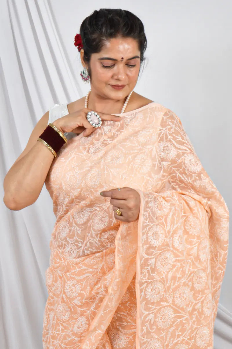 Handcrafted Orange Allover Kota Cotton saree with intricate Lucknowi Chikankari embroidery and a matching blouse, ideal for festive and wedding .