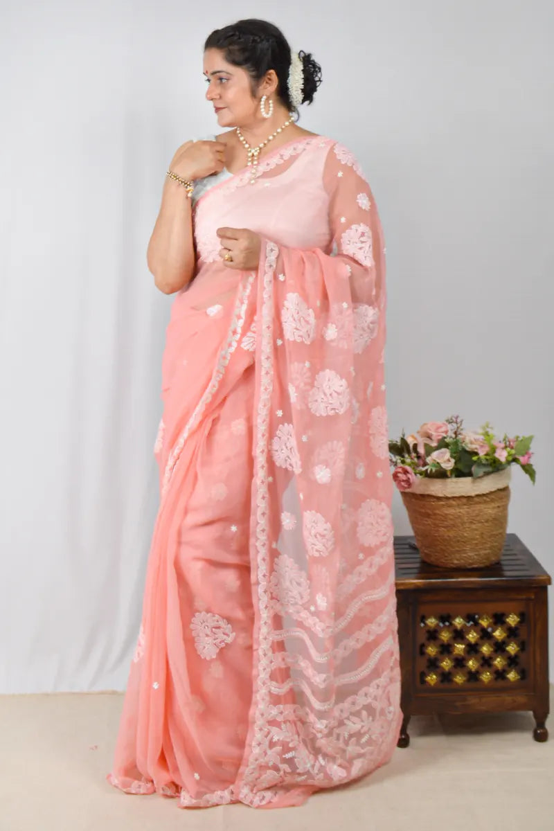 Peach georgette saree with handcrafted Lucknowi Chikankari embroidery and matching blouse – traditional elegance by MeMaana.