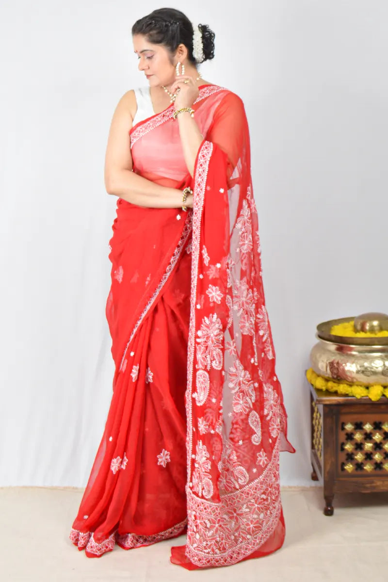 Red georgette saree with intricate Lucknowi Chikankari embroidery and matching blouse – handcrafted festive wear by MeMaana.