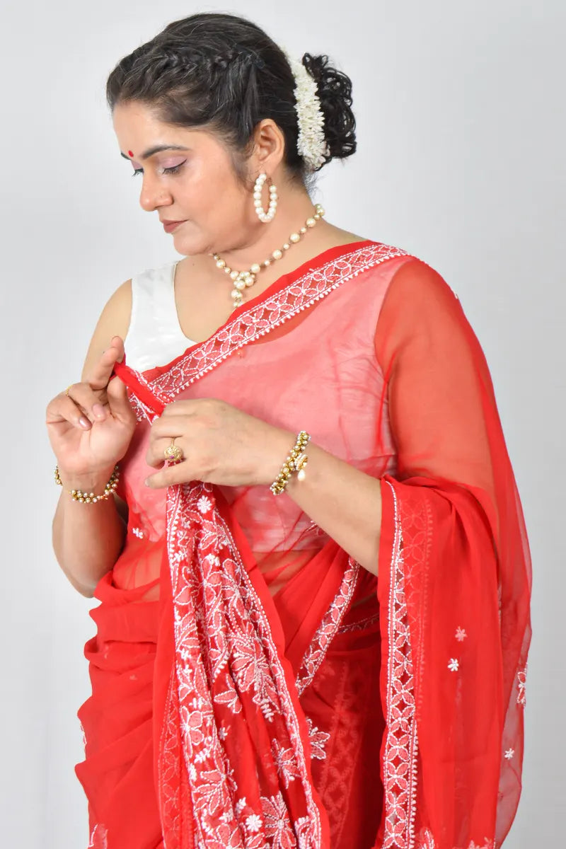 Red georgette saree with intricate Lucknowi Chikankari embroidery and matching blouse – handcrafted festive wear by MeMaana.