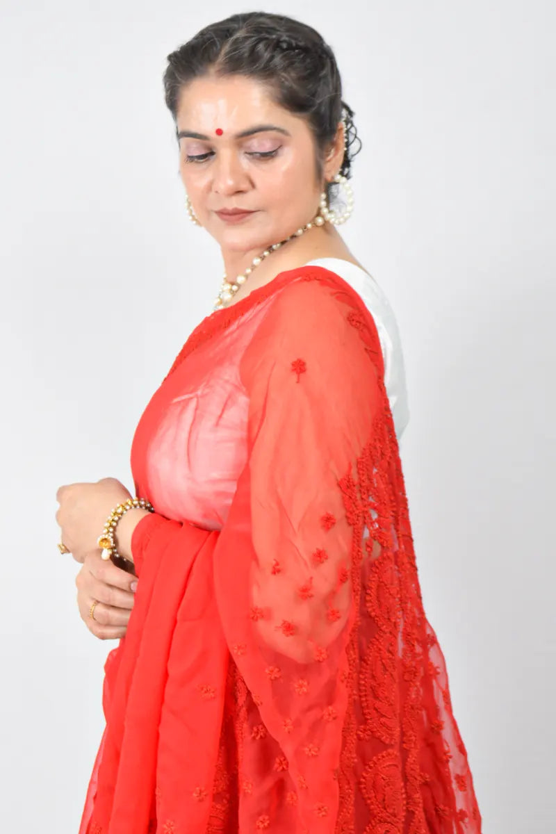 Red georgette saree with hand-embroidered Lucknowi Chikankari and unstitched blouse – festive and elegant ethnic wear by MeMaana.