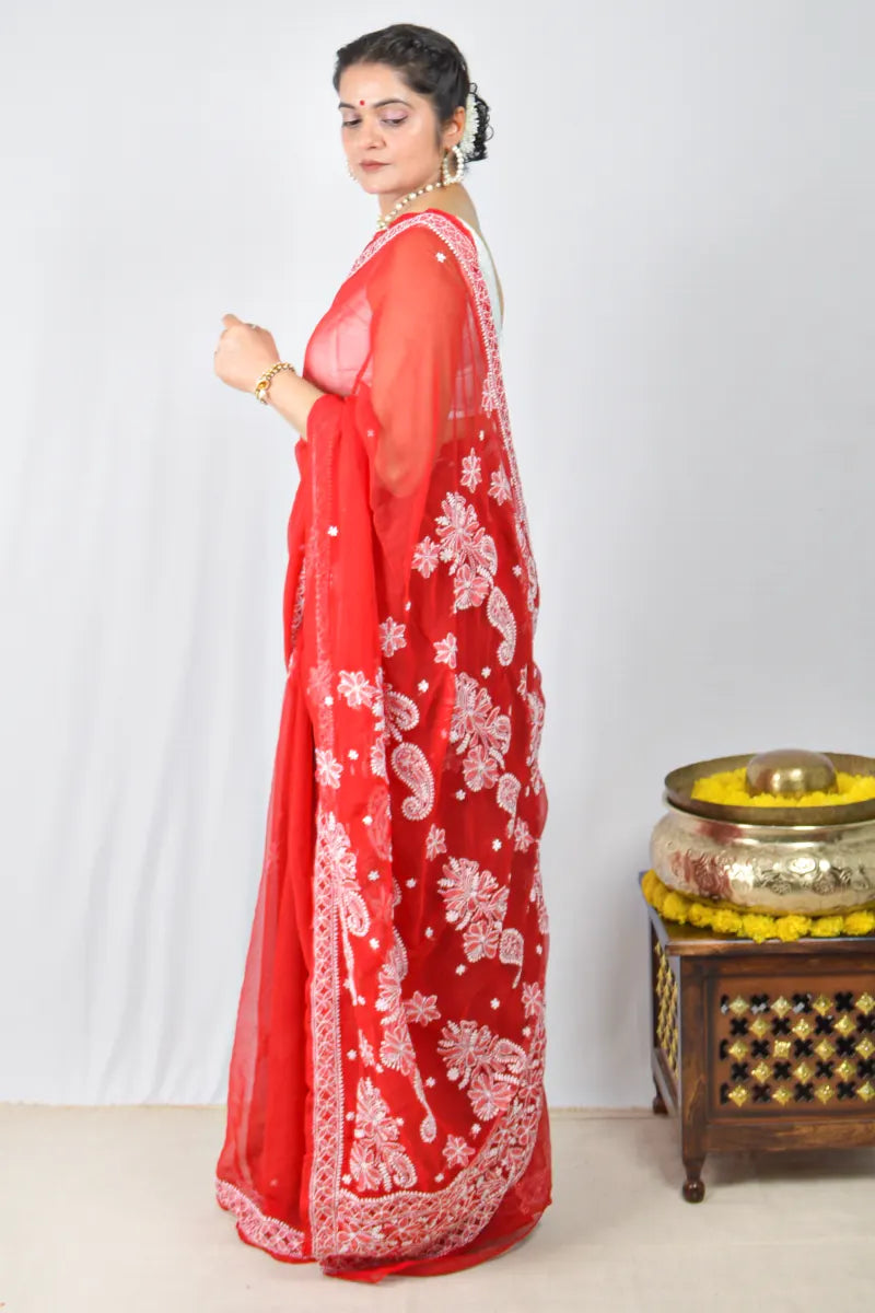 Red georgette saree with intricate Lucknowi Chikankari embroidery and matching blouse – handcrafted festive wear by MeMaana.