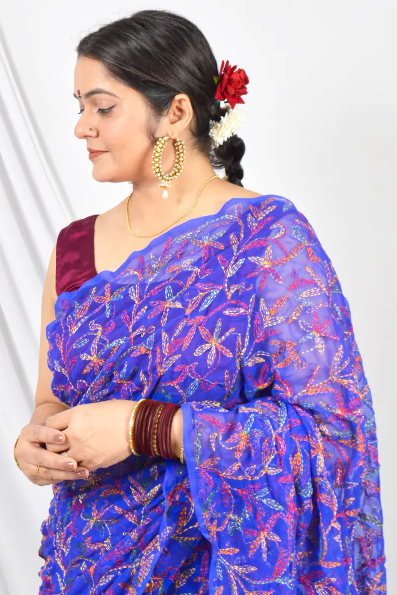 Handcrafted Royal Blue Georgette Tepchi saree intricate Lucknowi Chikankari embroidery and a matching blouse, ideal for festive and wedding occasions.