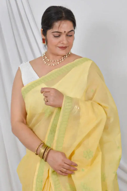 Handcrafted Yellow Cotton Saree with intricate Lucknowi Chikankari embroidery and a matching Blouse, ideal for Festive and occasions.