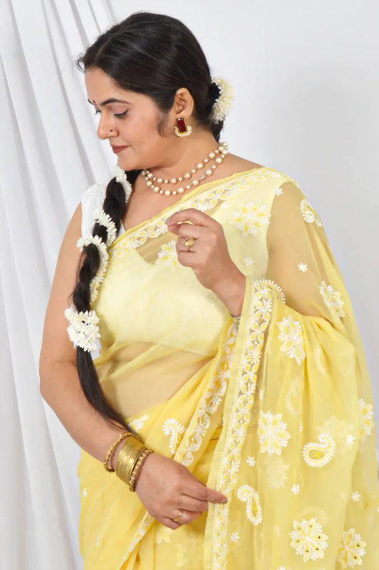 Handcrafted Yellow Georgette Saree with intricate Lucknowi Chikankari Embroidery and a matching Blouse, ideal for Festive and occasions.