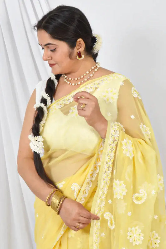 Handcrafted Yellow Georgette Saree with intricate Lucknowi Chikankari Embroidery and a matching Blouse, ideal for Festive and occasions.