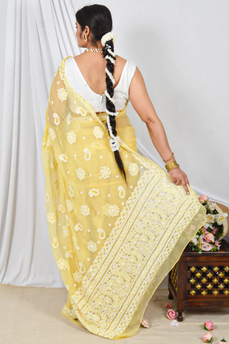 Handcrafted Yellow Georgette Saree with intricate Lucknowi Chikankari Embroidery and a matching Blouse, ideal for Festive and occasions.