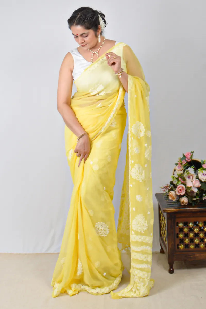 Yellow georgette saree with allover Lucknowi Chikankari and matching blouse – handcrafted festive wear by MeMaana.