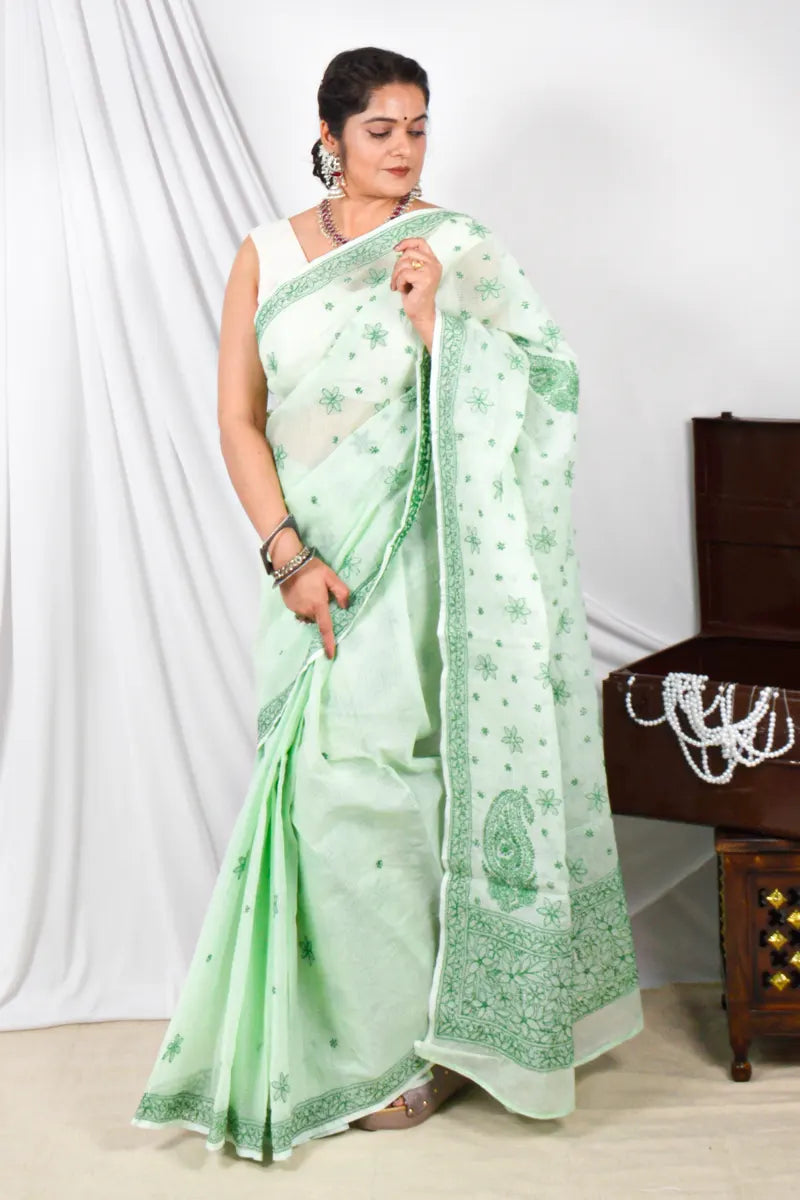 Handcrafted Green Kota Cotton Designer saree with intricate Lucknowi Chikankari embroidery and a matching blouse, ideal for festive and wedding occasions.