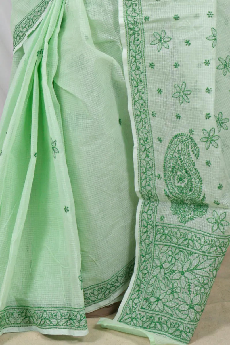 Handcrafted Green Kota Cotton Designer saree with intricate Lucknowi Chikankari embroidery and a matching blouse, ideal for festive and wedding occasions.