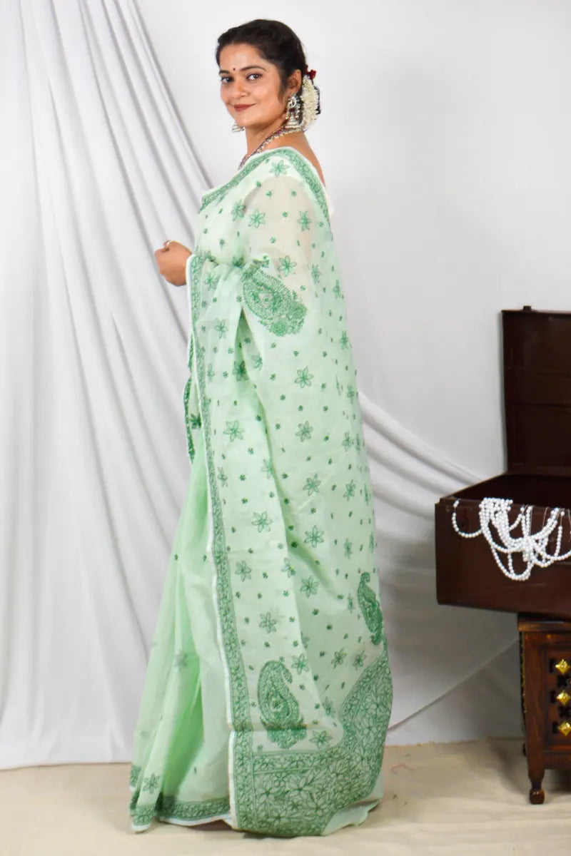 Handcrafted Green Kota Cotton Designer saree with intricate Lucknowi Chikankari embroidery and a matching blouse, ideal for festive and wedding occasions.