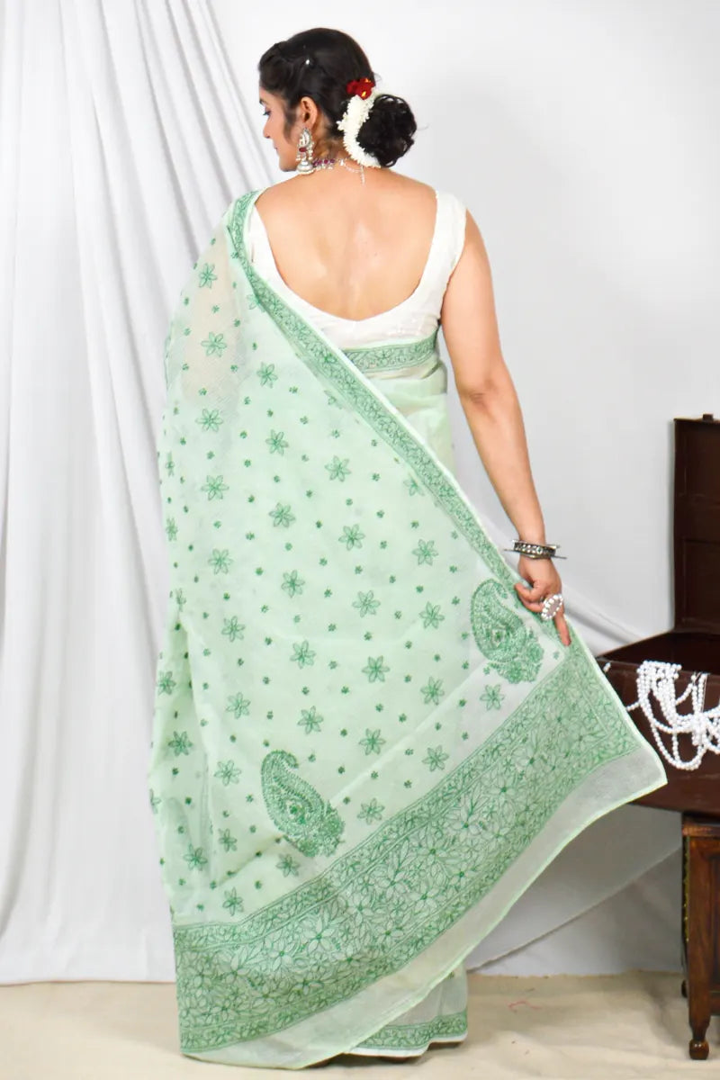 Handcrafted Green Kota Cotton Designer saree with intricate Lucknowi Chikankari embroidery and a matching blouse, ideal for festive and wedding occasions.