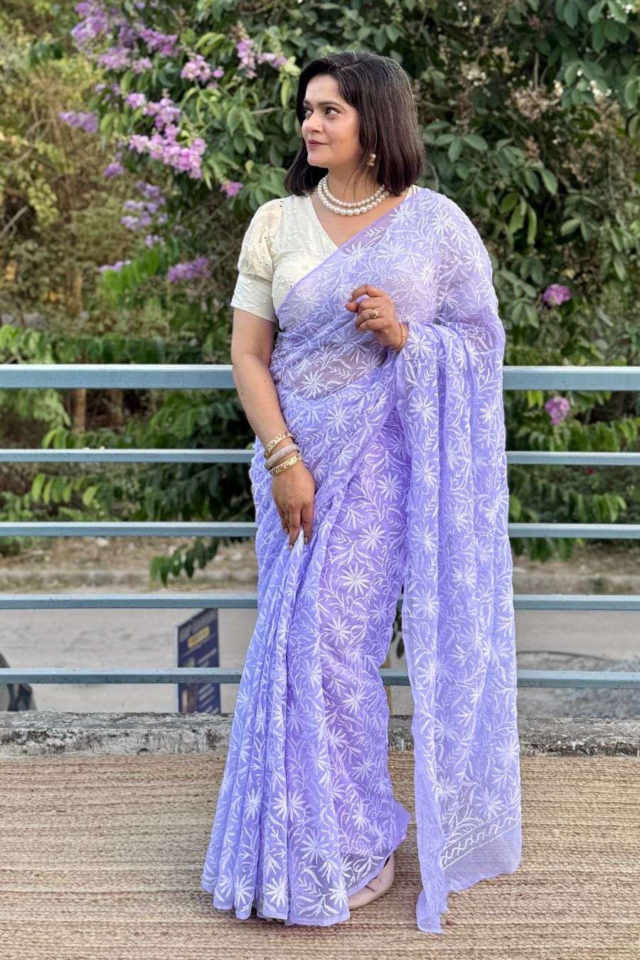 Elegant pastel saree styling with pearl jewelry look