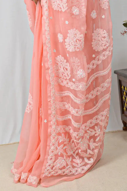 Peach georgette saree with handcrafted Lucknowi Chikankari embroidery and matching blouse – traditional elegance by MeMaana.