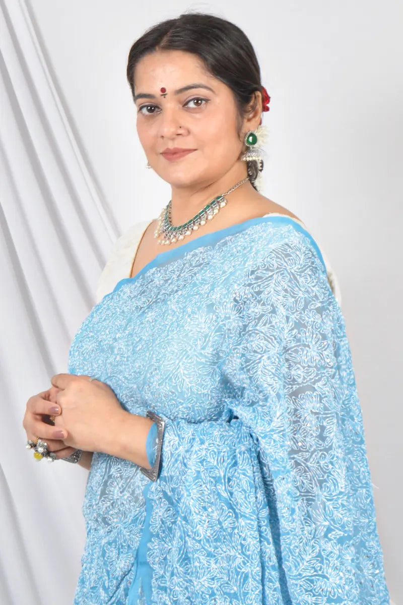 Aqua Blue Color Georgette Allover Tepchi Lucknowi Chikankari Saree With Mukaish Work Embroidery and Blouse – Perfect for Weddings & Festive Wear.