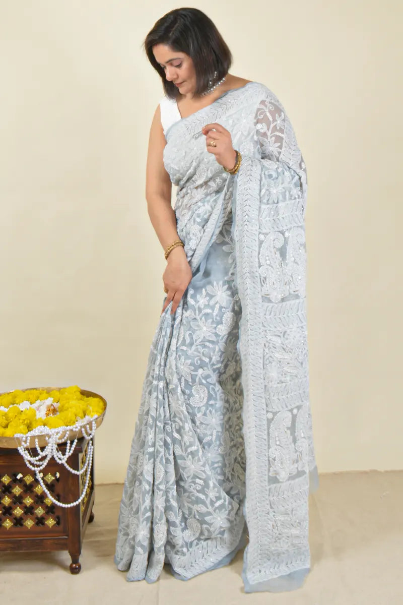 Handcrafted Gray Allover saree with intricate Lucknowi Chikankari embroidery and a matching blouse, ideal for festive and wedding occasions.