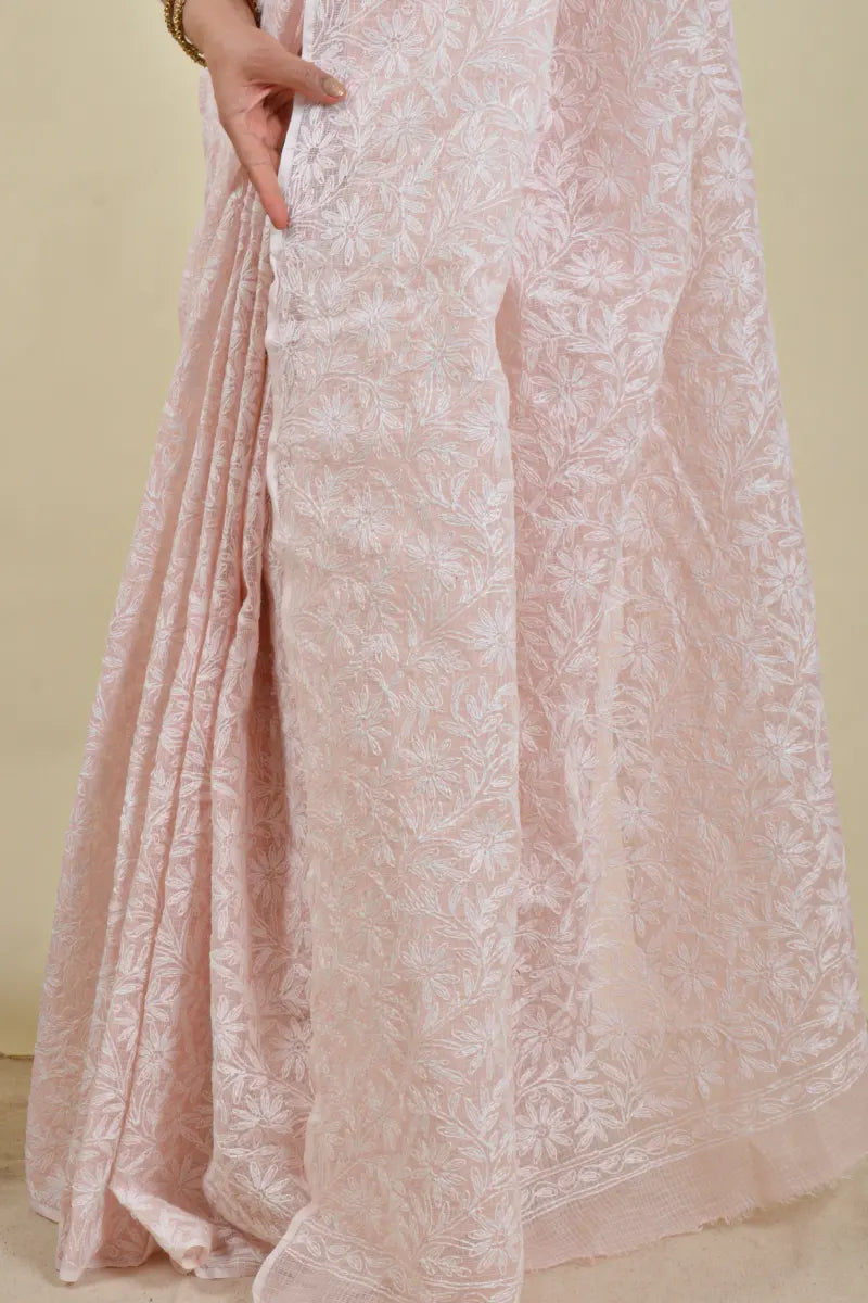 Handcrafted Baby Pink Kota Cotton saree with intricate Lucknowi Chikankari embroidery and a matching blouse, ideal for festive and wedding occasions.