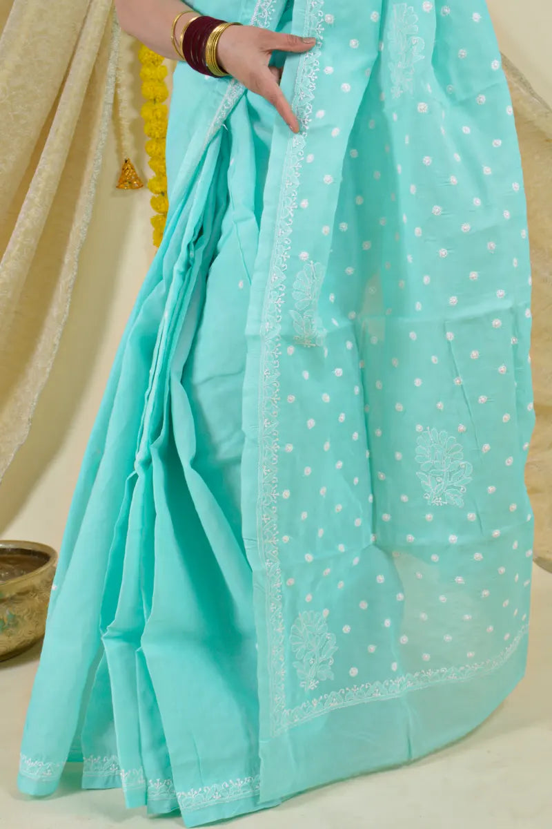 Handcrafted Sea Green Cotton Saree with intricate Lucknowi Chikankari embroidery and a matching blouse, ideal for festive and wedding occasions.