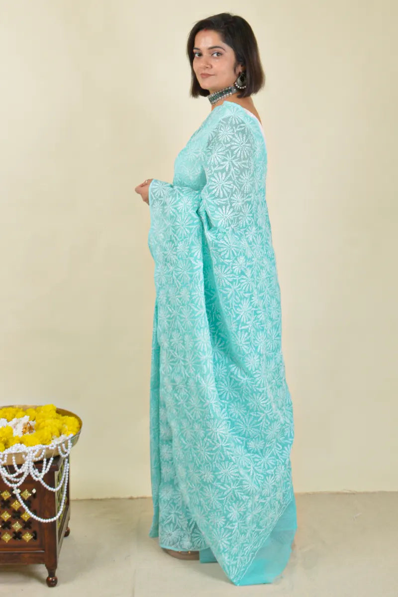 Handcrafted Sea green Kota Cotton saree with intricate Lucknowi Chikankari embroidery and a matching blouse, ideal for festive and wedding occasions.