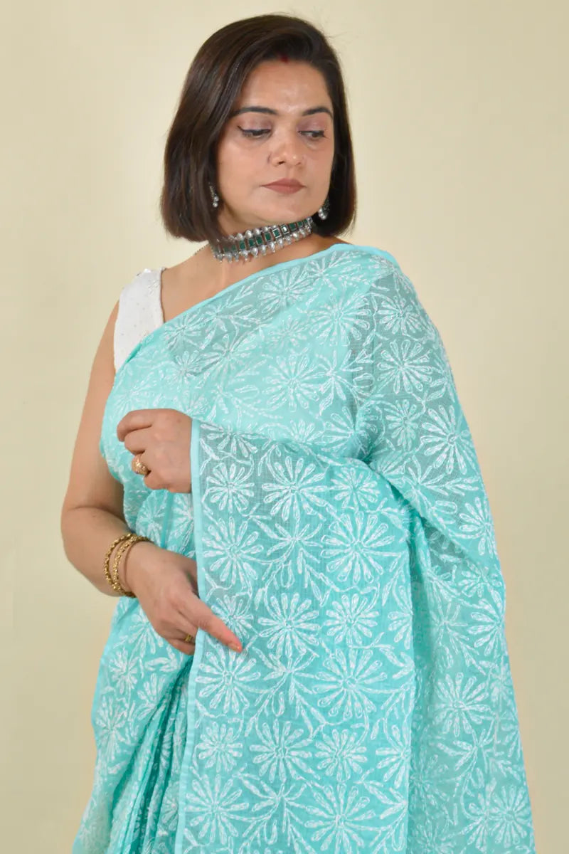Handcrafted Sea green Kota Cotton saree with intricate Lucknowi Chikankari embroidery and a matching blouse, ideal for festive and wedding occasions.