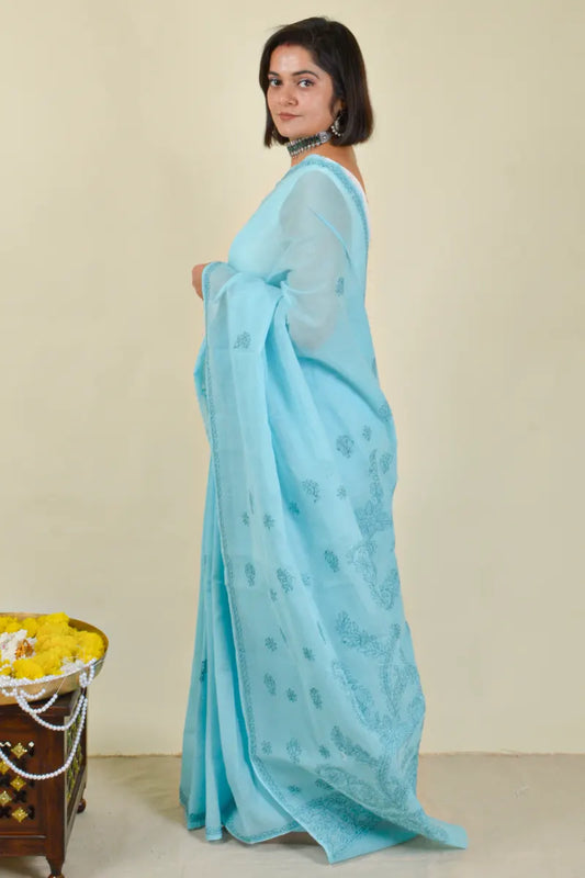 Handcrafted Blue Cotton saree with intricate Lucknowi Chikankari embroidery and a matching blouse, ideal for festive and wedding occasions.