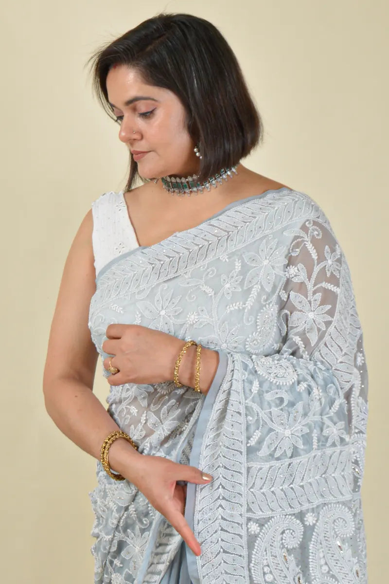 Handcrafted Gray Allover saree with intricate Lucknowi Chikankari embroidery and a matching blouse, ideal for festive and wedding occasions.