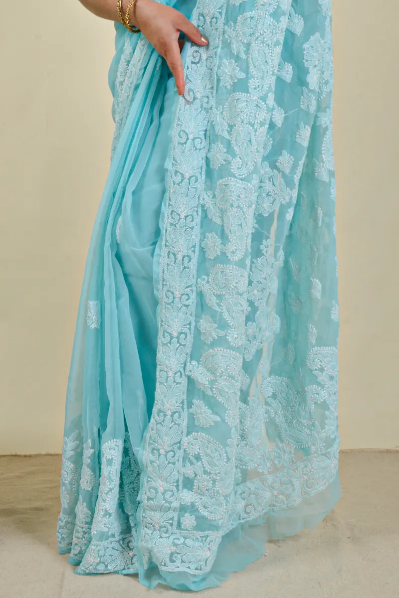 Handcrafted Georgette saree with intricate Lucknowi Chikankari Embroidery and a matching Blouse, ideal for festive and wedding occasions.