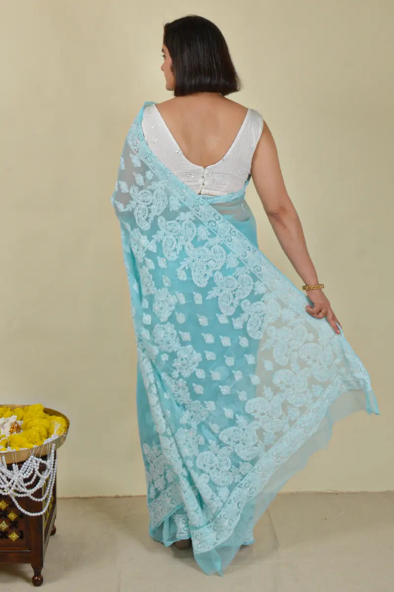 Handcrafted Georgette saree with intricate Lucknowi Chikankari Embroidery and a matching Blouse, ideal for festive and wedding occasions.