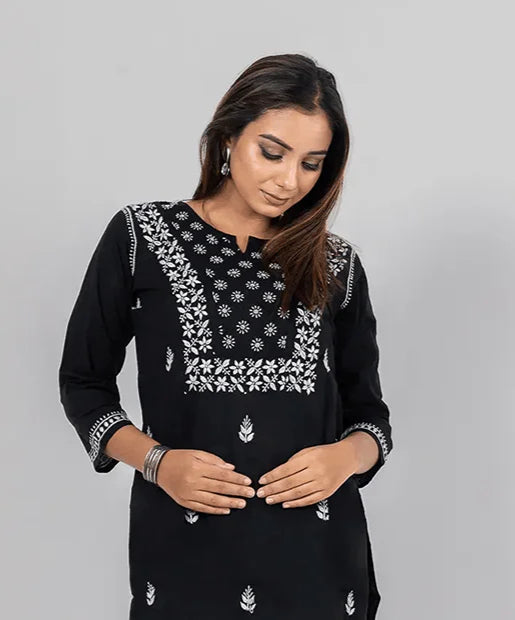 Fabnuma Handcrafted Chikankari Cotton Black Short Top with intricate white embroidered floral design on black cotton fabric.