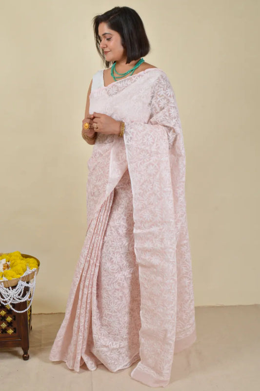 Handcrafted Baby Pink Kota Cotton saree with intricate Lucknowi Chikankari embroidery and a matching blouse, ideal for festive and wedding occasions.