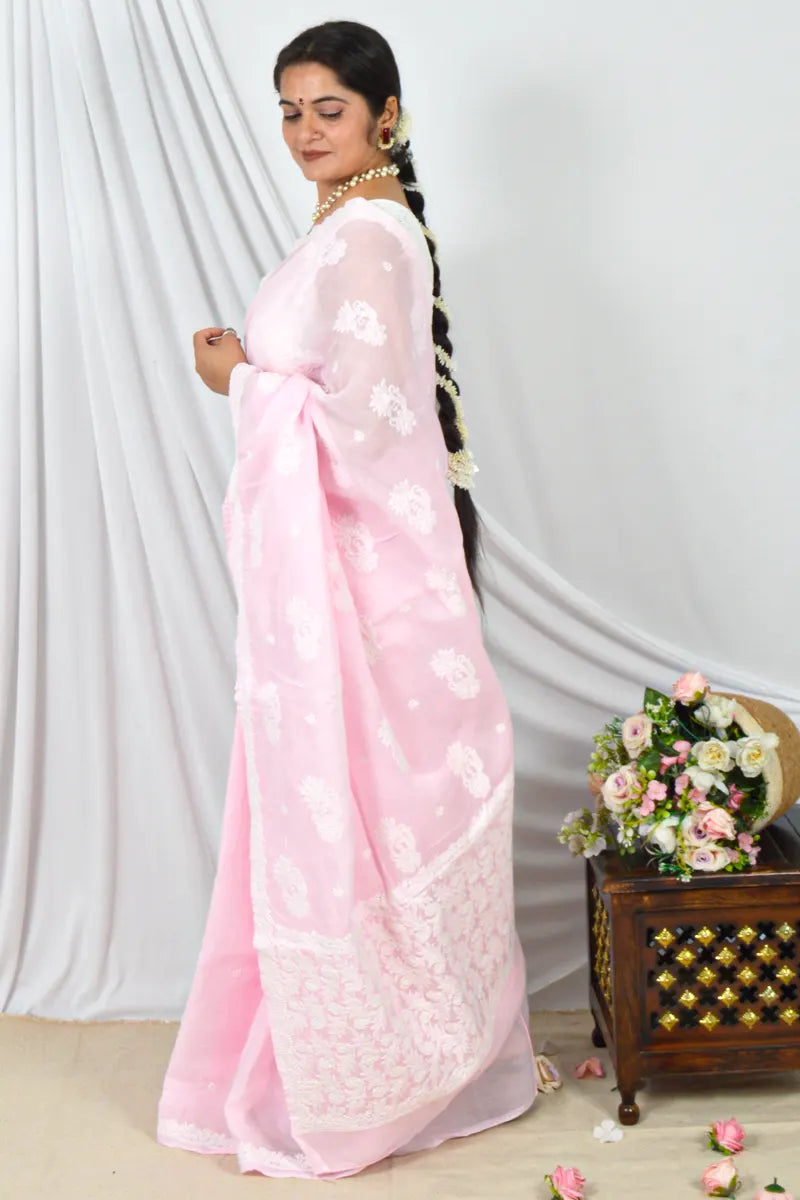 Memaana Handcrafted Pink Cotton Border Palla Chikankari Saree worn by woman with floral embroidery and matching blouse.