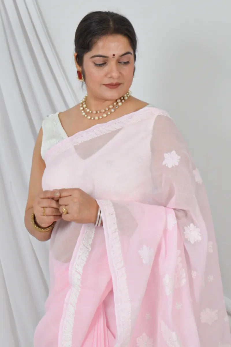 Woman wearing Fabnuma Handcrafted Pink Cotton Border Palla Chikankari Saree with Blouse in elegant pink shade.